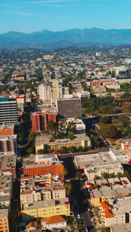 nobody cityscape. top down aerial of cars drive at cross road. vertical video
