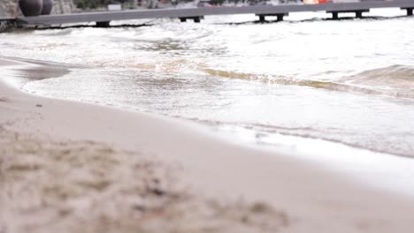 waves on the sandy beach at the lake 4k