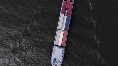 dutch container vessel sailing on a river