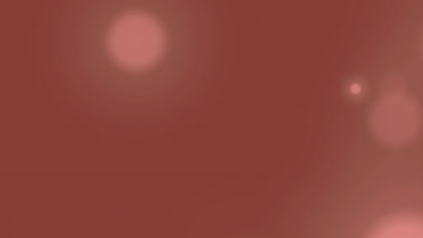 animation of spots of lights over red background