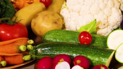 assorted vegetables arranged on a black background