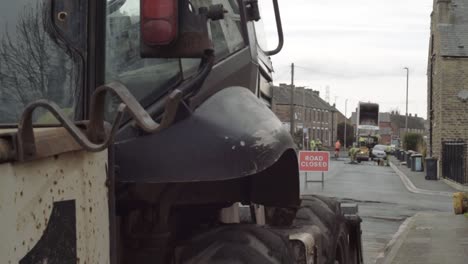 Road-closed-with-sign-and-heavy-plant-digger