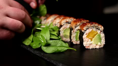 chef preparing a delicious eel sushi roll