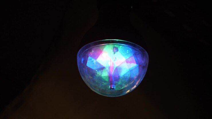Light effect ball spinning in dark background, Slow motion
