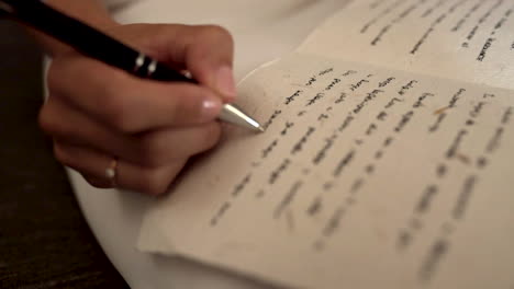 close up of female hand writing. gimbal