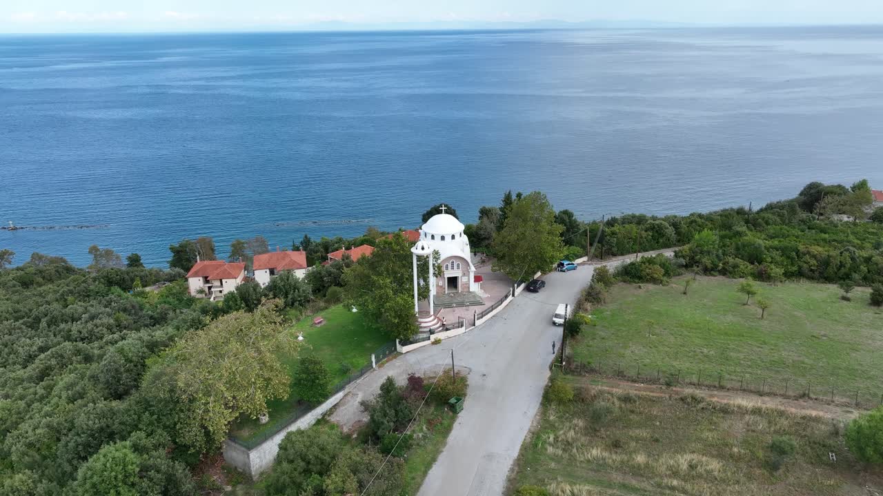 White-domed church near the sea in Katerini Platamonas, Greece, aerial scenic view