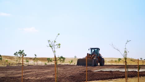 Forklift-Earth-Mover-Bulldozer-flattening-a-plot-of-land