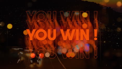 animation of you win text over glowing spot lights