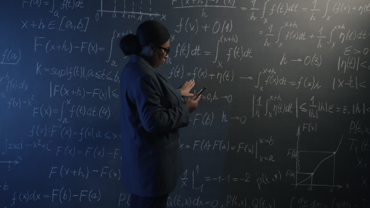Female Professor or Student in a Classroom Studying