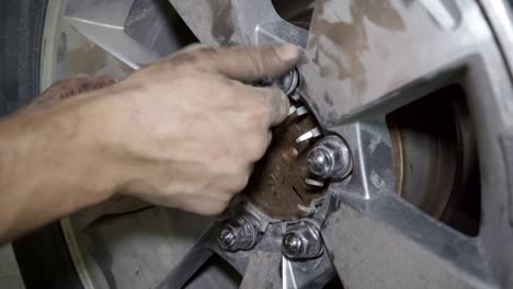 mechanic changing a car wheel closeup