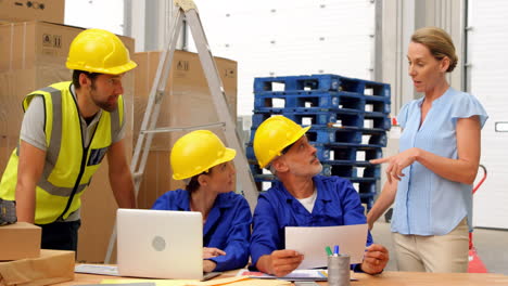 warehouse worker using a laptop