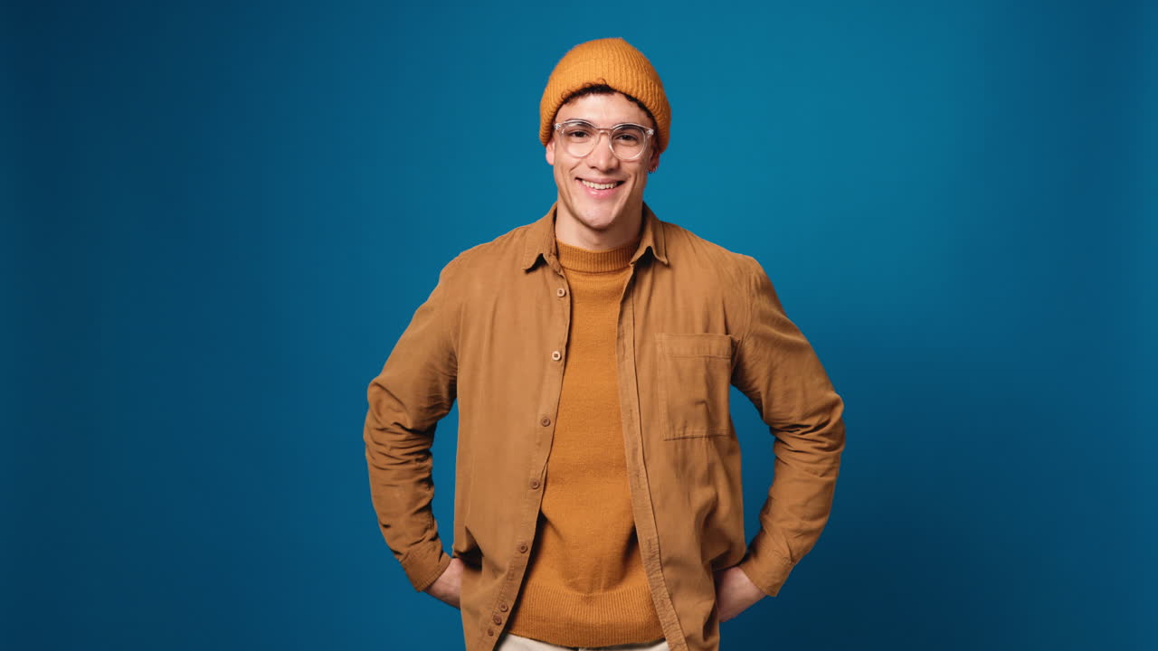 Portrait of a stylish man with a hat and glasses