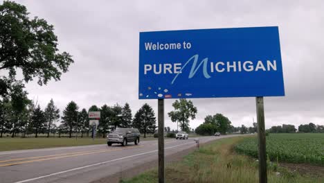 Welcome-to-Pure-Michigan-sign-on-the-state-line-of-Michigan-and-Indiana-with-stable-video