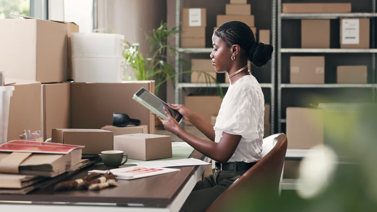 Young Black Woman Managing Online Store and Packaging Orders