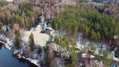 aerial view of anyksciai laju takas, treetop walking path complex with a walkway, an information center and observation tower, located in anyksciai, lithuania near sventoji river