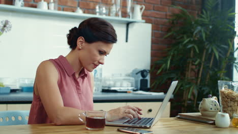 woman finishing work on computer