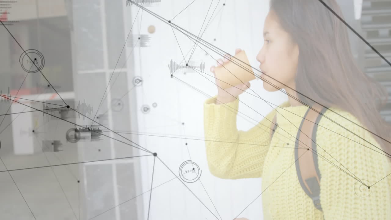 Female student drinking from paper cup in modern tech corridor, with animated data visuals overlay