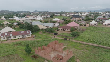 aerial - cityscape in jos plateau, nigeria, forward shot