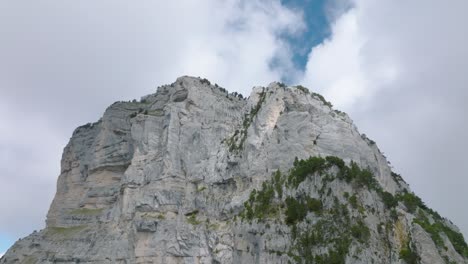 Approaching-summit-of-a-rock-mountain-with-clouds,-Mount-Granier