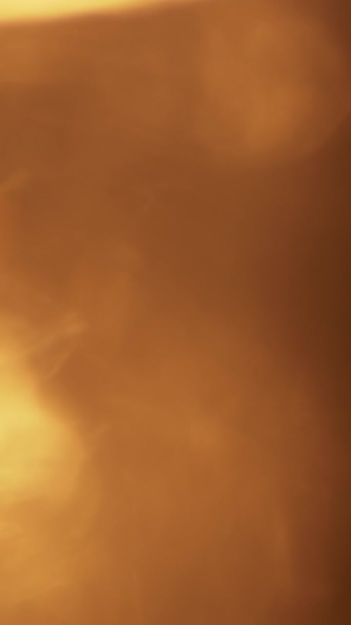 Fughe di Luce Astratte Dorate Calde e Bagliori dell'Obiettivo