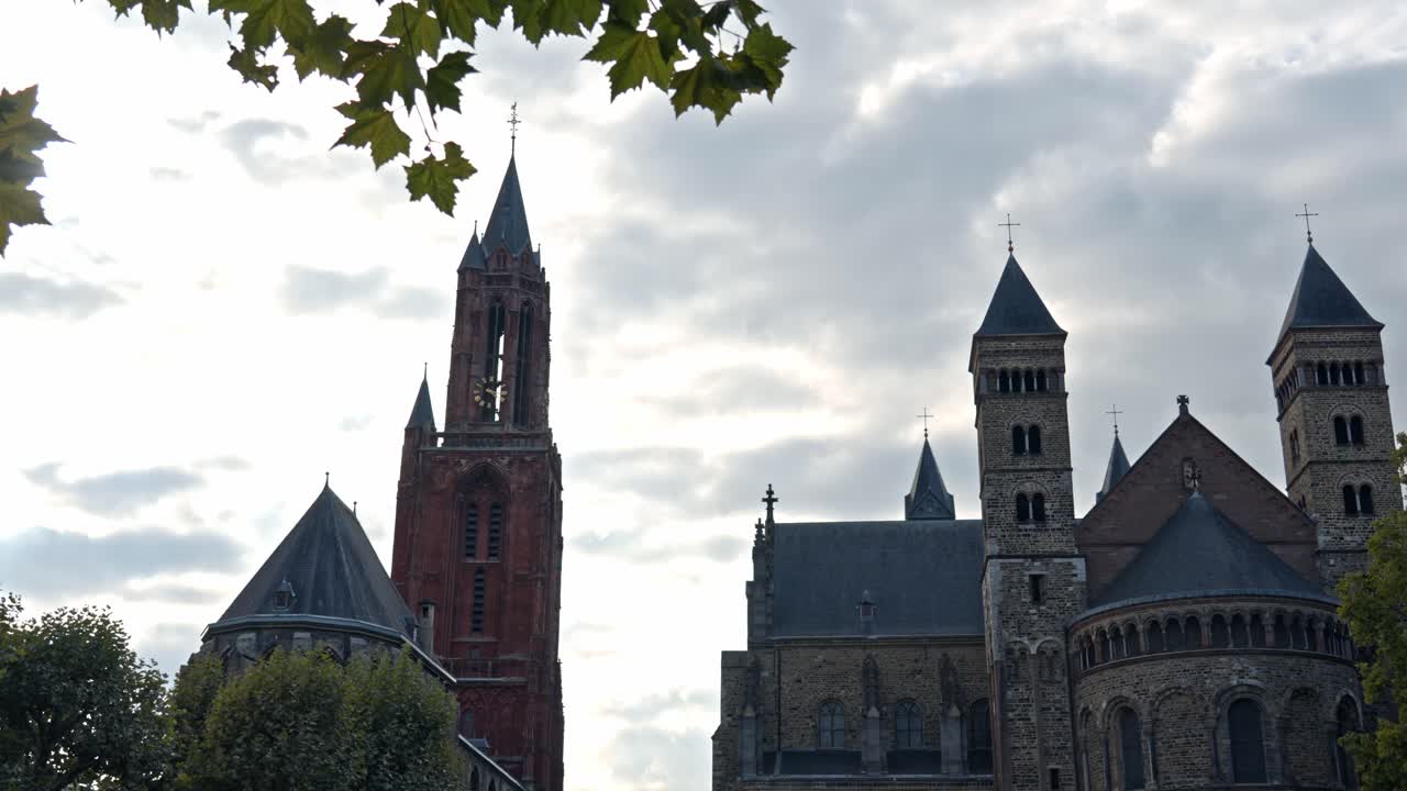 The iconic red tower of the Sint-Janskerk (St. John's Church), one of the city's most recognizable landmarks located on the famous Vrijthof square