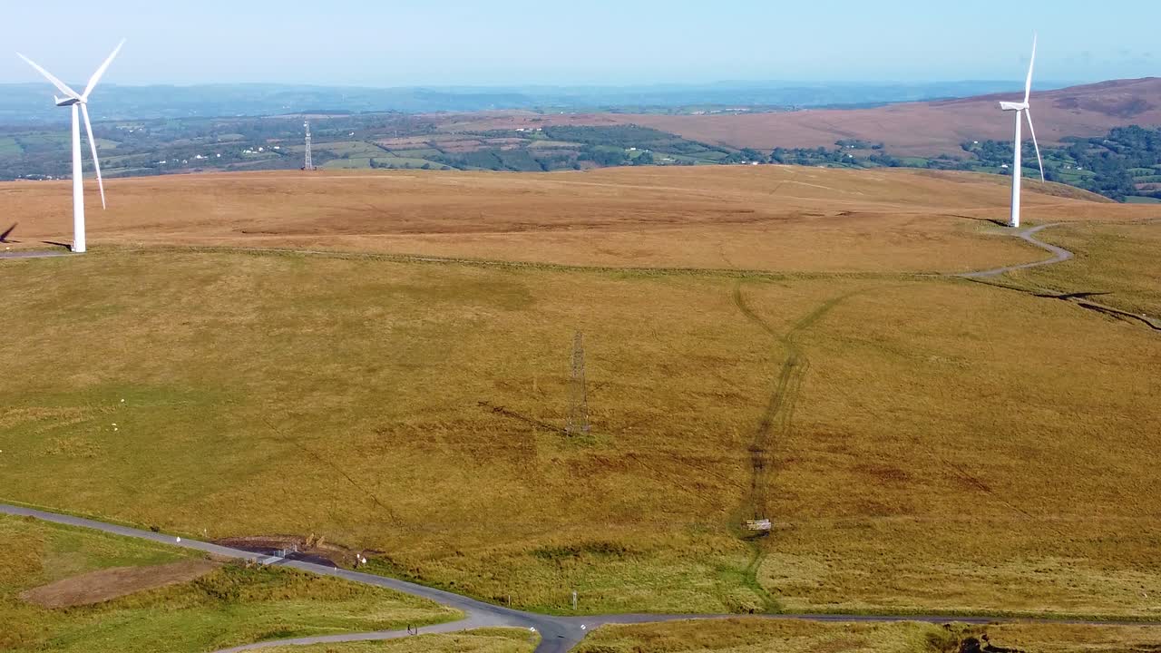 Aerial View of a Wind Farm on a Hilly Landscape
