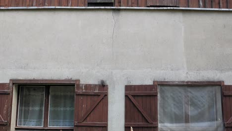 exterior details of an old traditional house in pradzonka, pomeranian voivodeship, poland - tilt-up shot