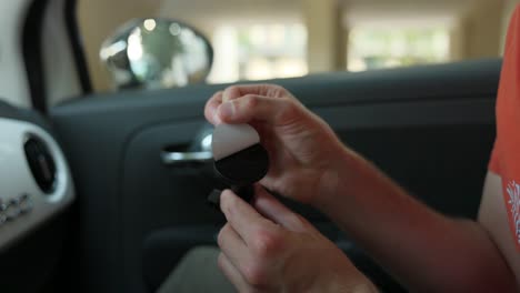 peeling sticker off quick release mount for action camera inside car