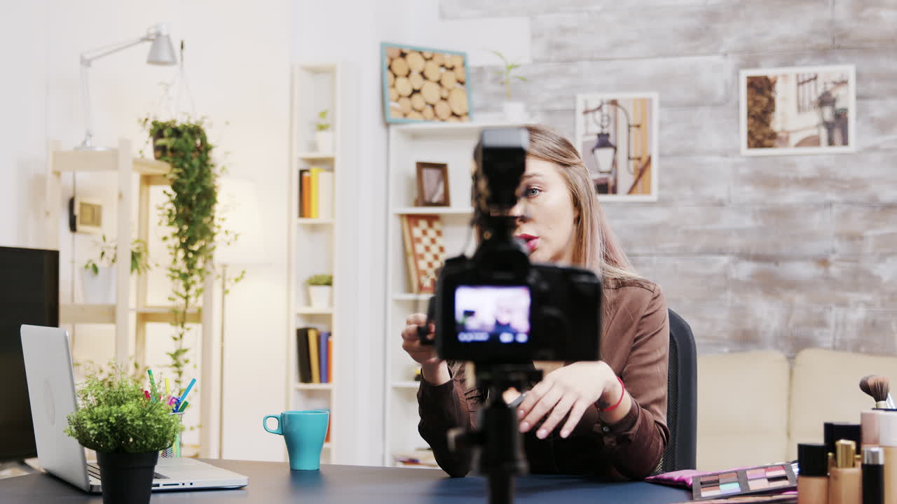 Beauty vlogger recording makeup tutorial