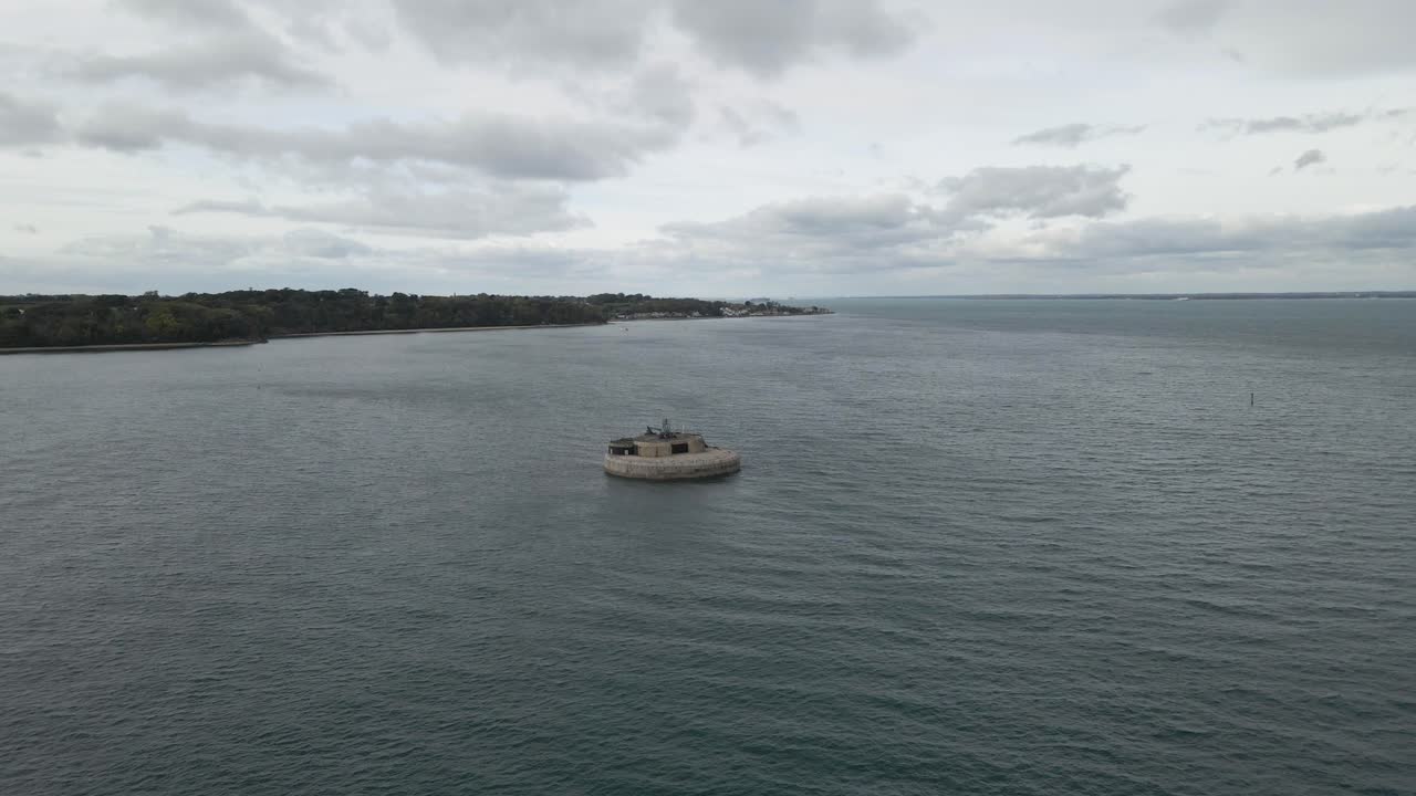 Aerial view St Helens Fort, sea fort in the Solent close to the Isle of Wight, was built as result of the Royal Commission on the Defence of the United Kingdom of 1859, drone moving towards the fort