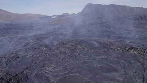 gas and smoke rising from lava flowing in the valley due to fagradalsfjall, geldingadalsgos eruption