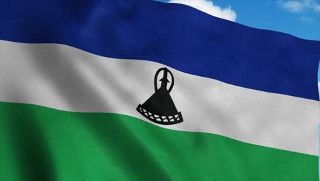 lesotho flag waving in the wind, blue sky background. 4k