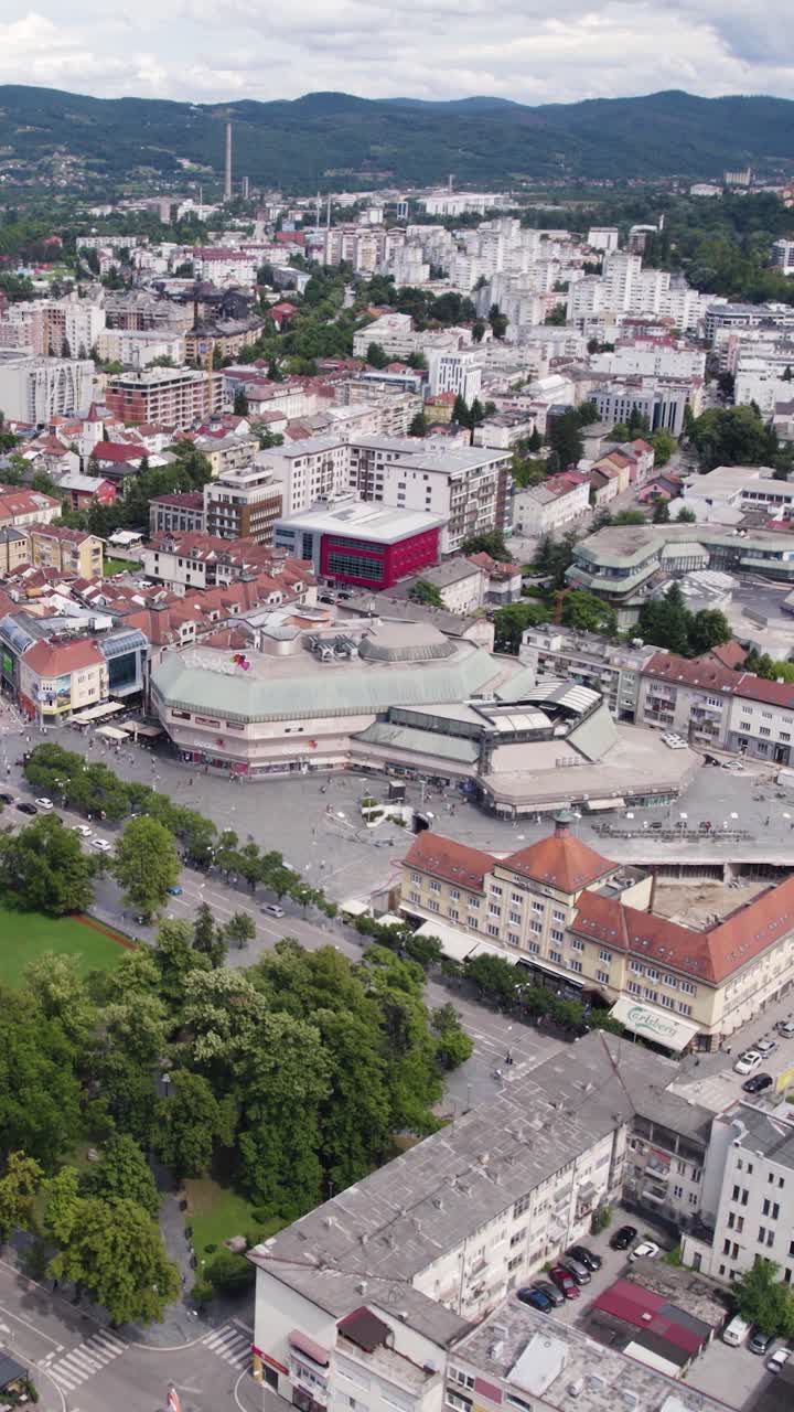 Busy cityscape with Boska shopping centre in central Banja Luka, Bosnia. Vertical View