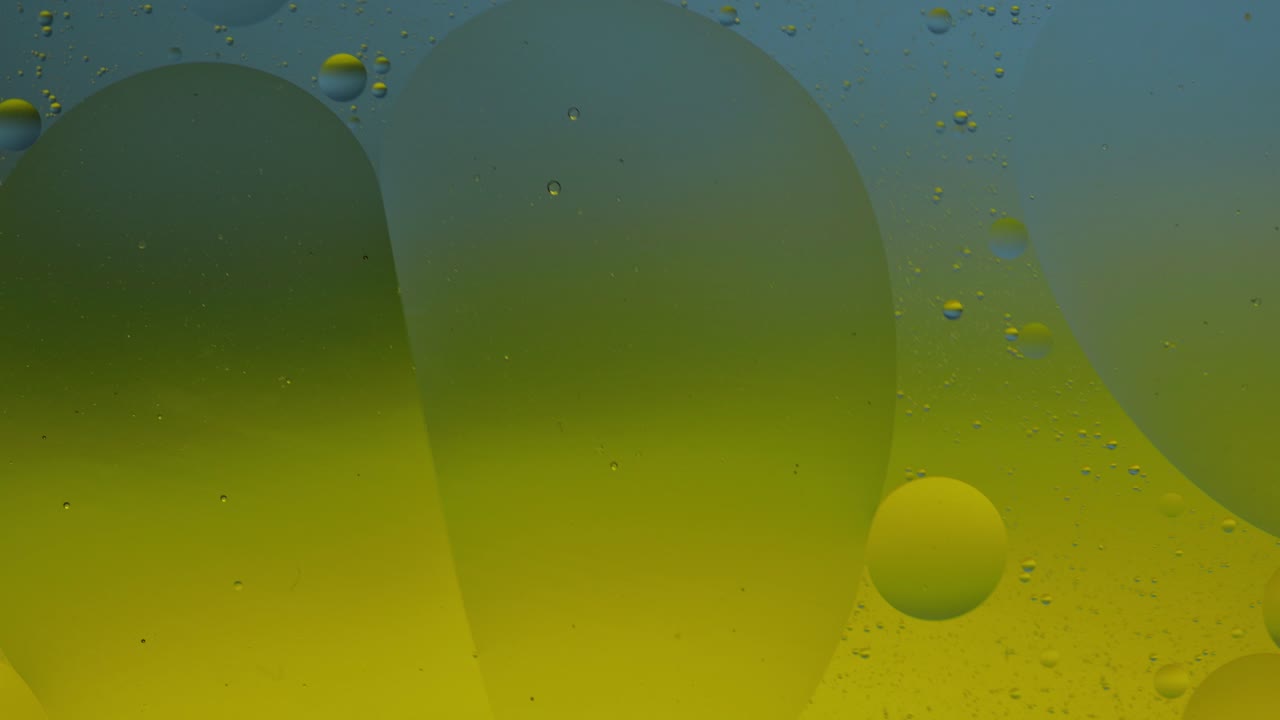la macroestructura de las burbujas de aceite coloridas. movimiento caótico. fondo multicolor abstracto. patrón