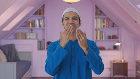 happy muslim man giving flying kisses