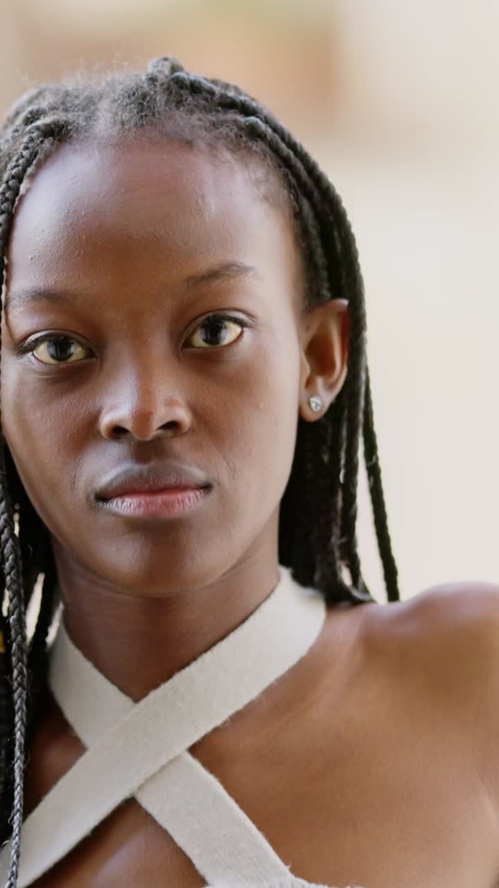 Close-up portrait of a woman with braided hair