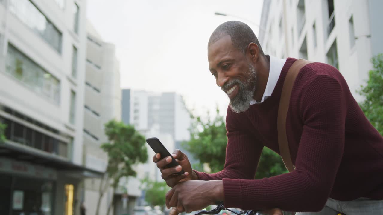 African American man using his phone in the street