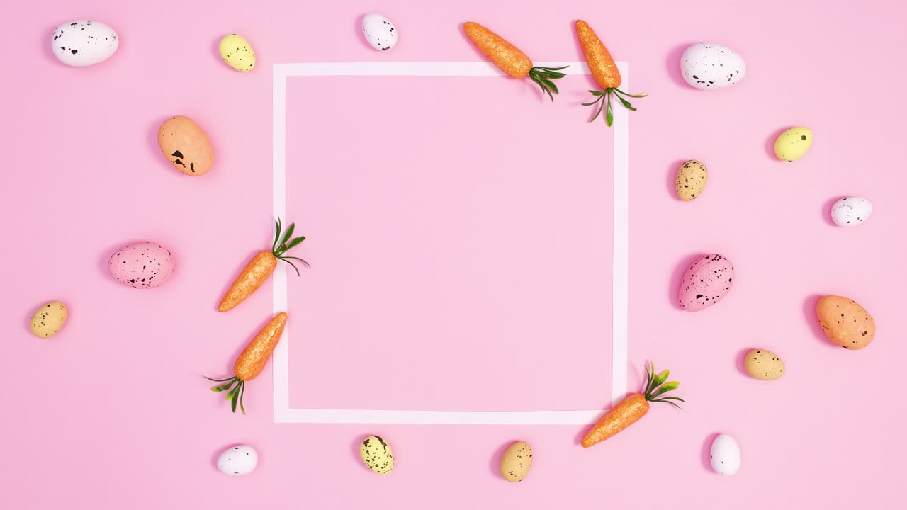 los huevos de pascua de arreglo pastel aparecen alrededor del marco de espacio de copia en un fondo rosa brillante.