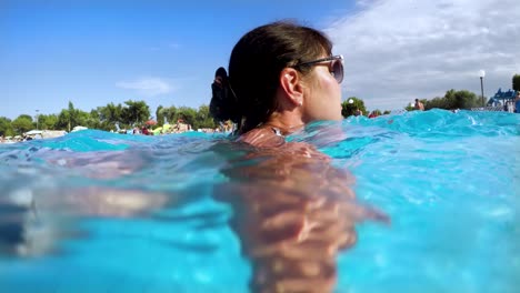 swimming pool. woman swimming in the poolin the pool under water.