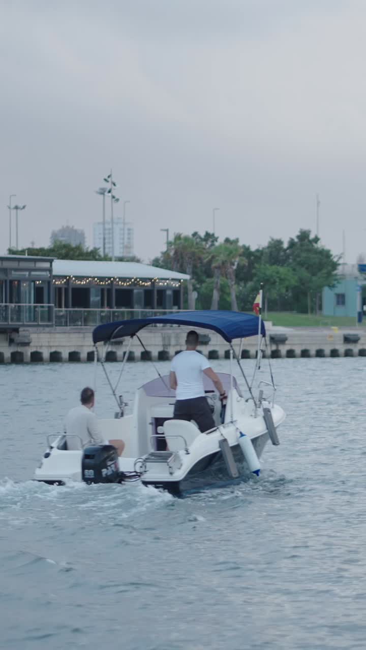 A motorboat on the water with people aboard