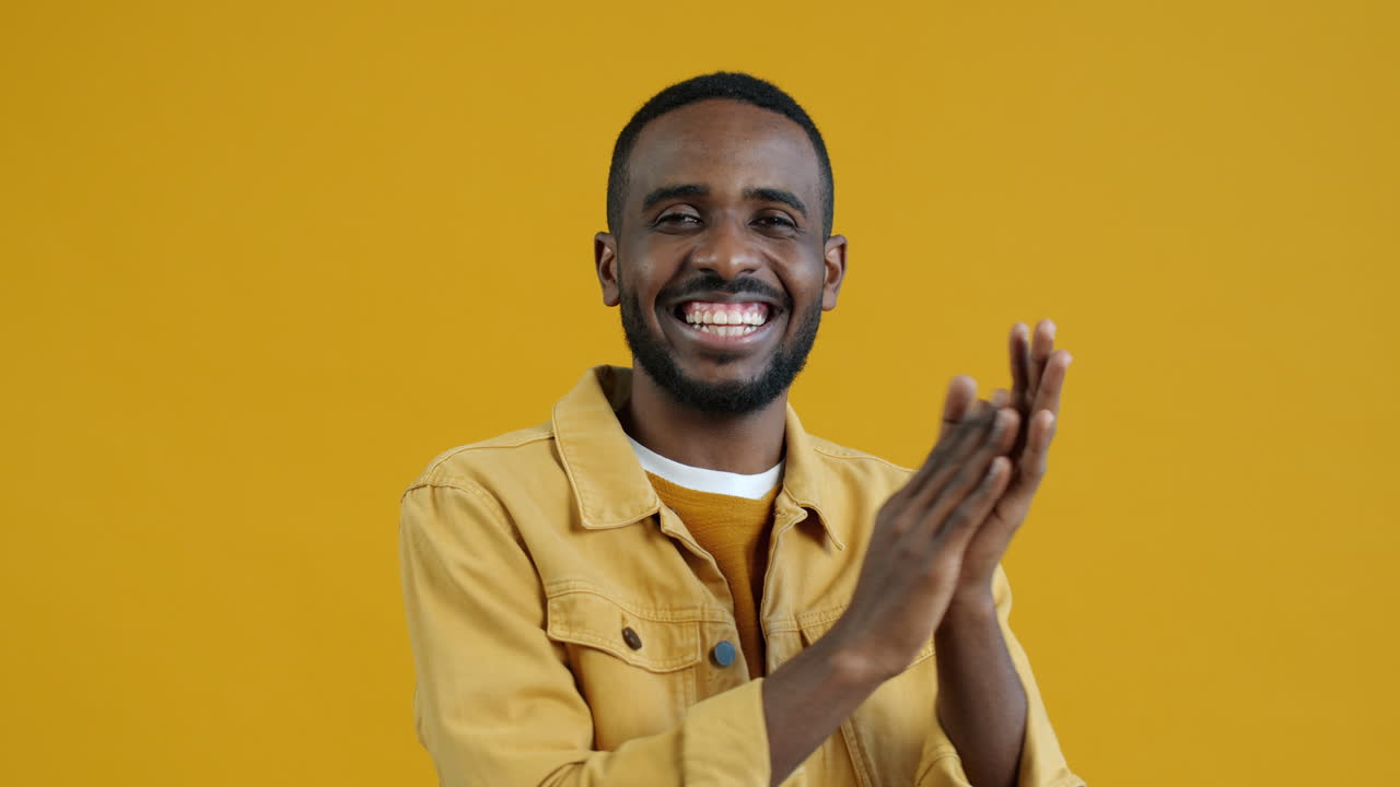 Man clapping with happiness