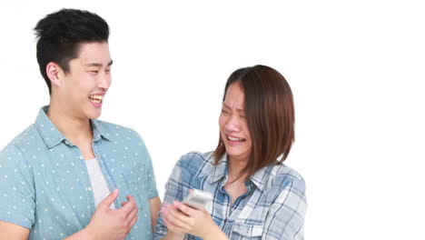 smiling young couple taking a selfie