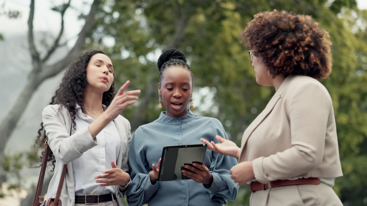 Tablet, architecture and business women in park