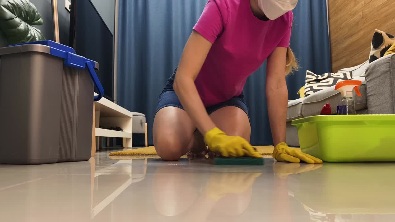 Woman cleaning the floor at home