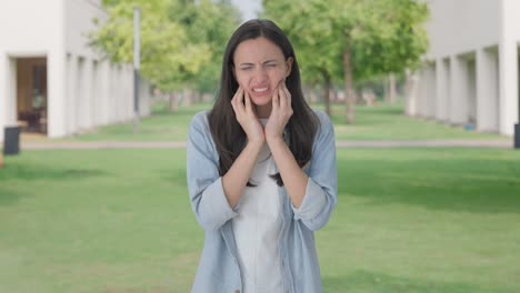 Sick-Indian-girl-suffering-from-tooth-pain