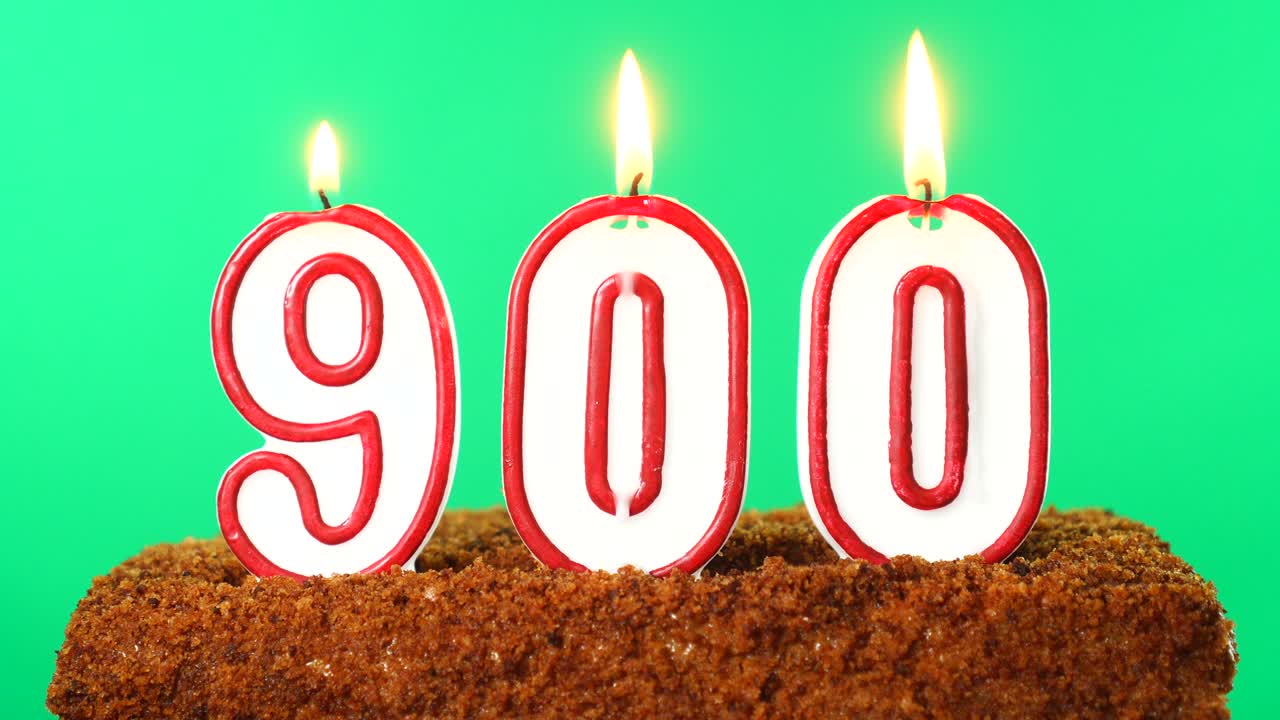Cake with the number 900 lighted candle. Chroma key. Green Screen. Isolated