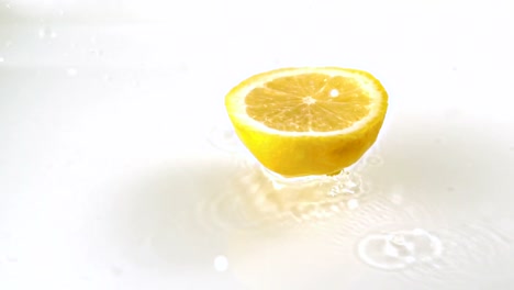Lemon-slices-falling-into-water