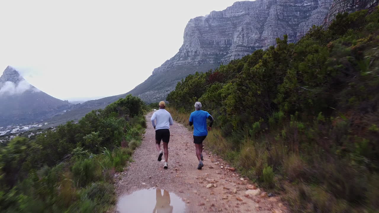 People trail running in nature