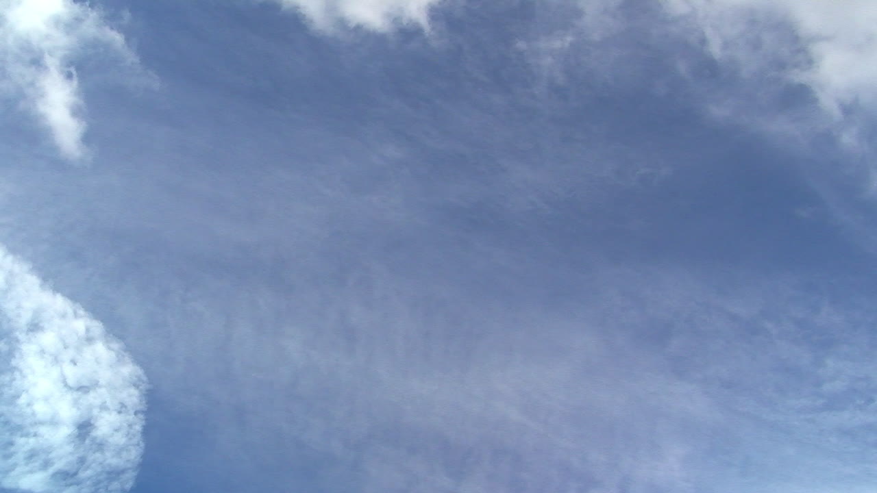 Cloud front moves across sky in time-lapsed motion