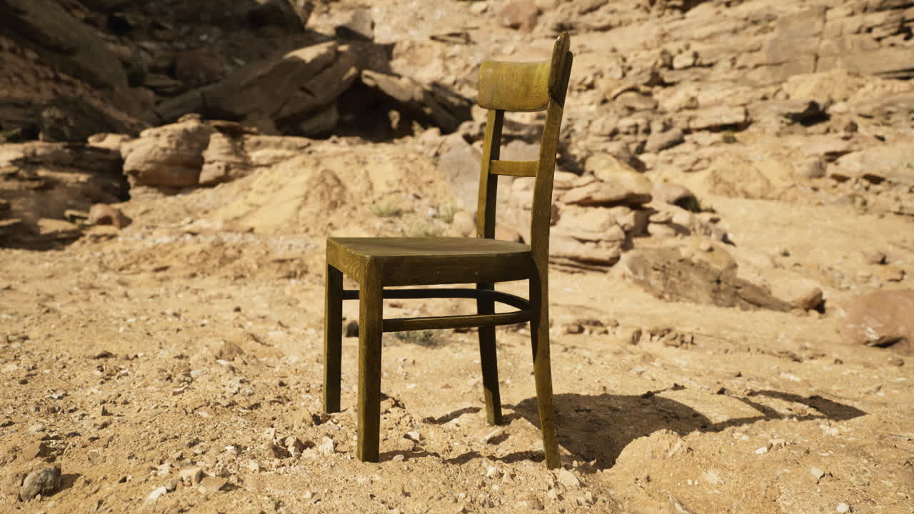 Unique rustic chair positioned in a sandy landscape surrounded by rocks
